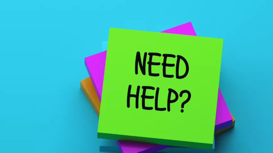 a colorful note that reads "need help?" 