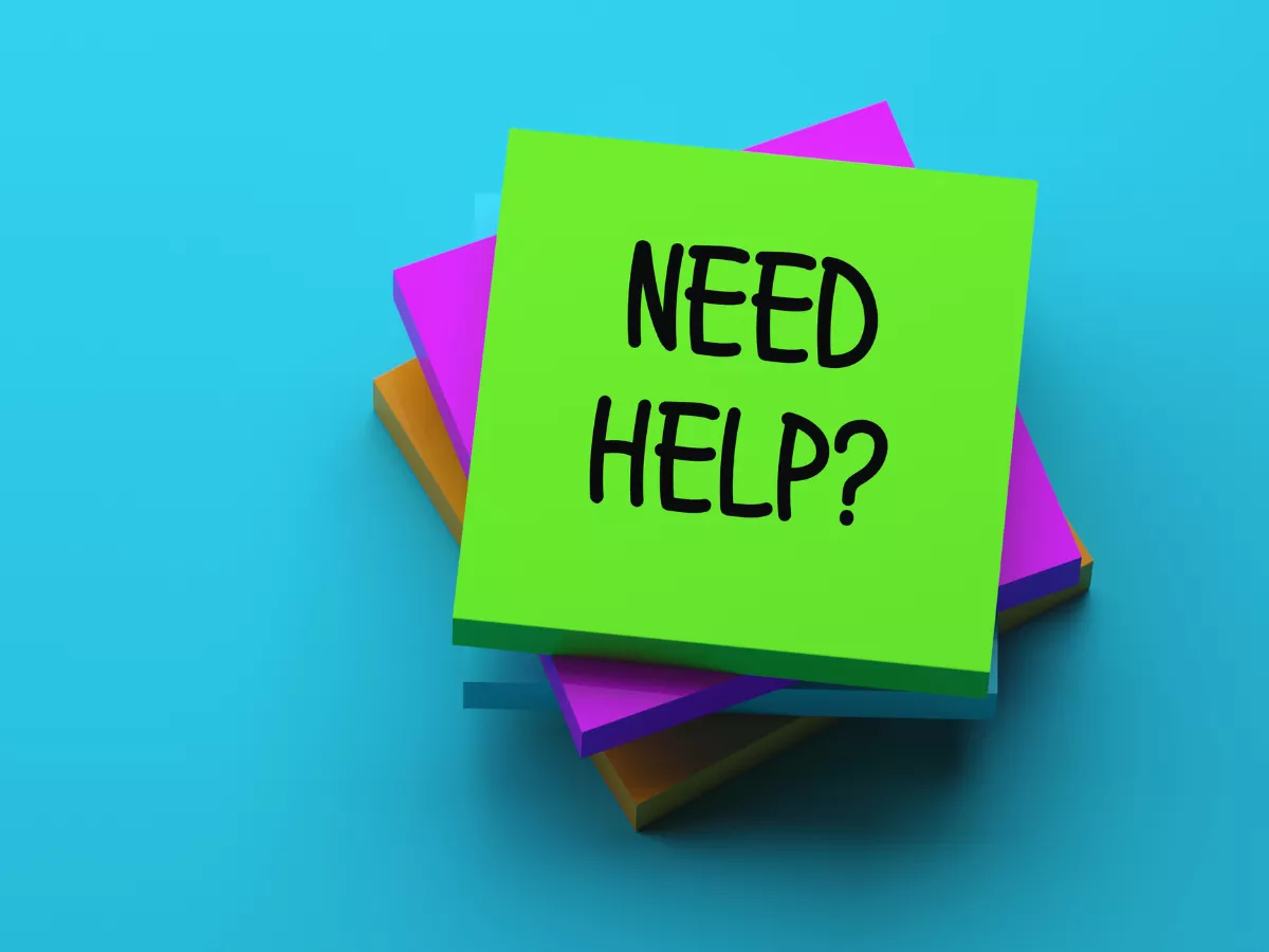 a colorful note that reads "need help?"