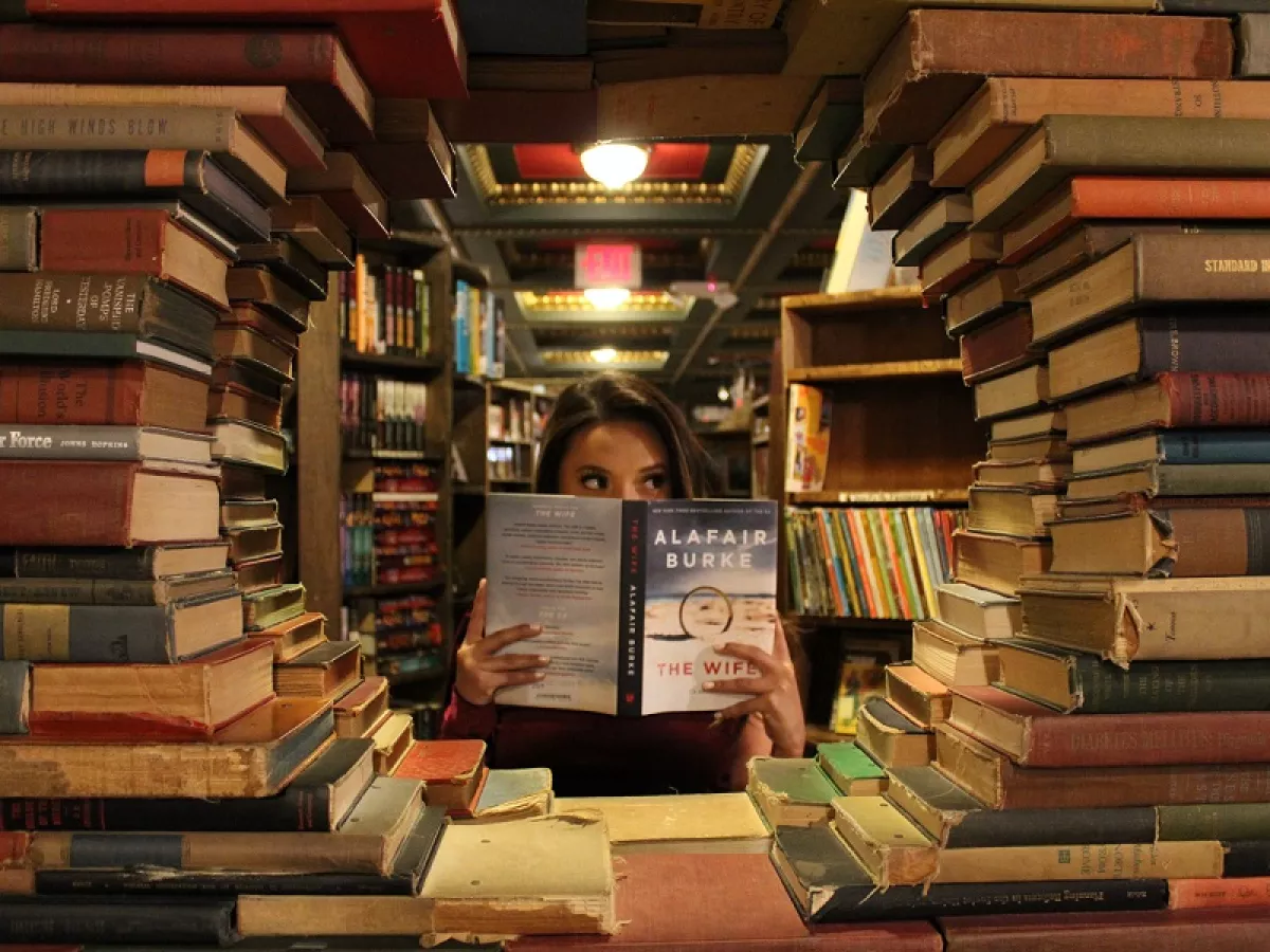 woman surrounded by books