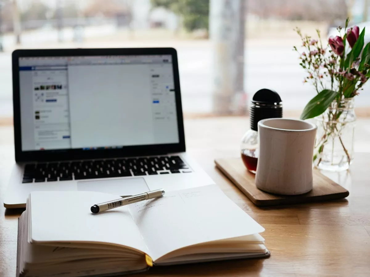 laptop and writing materials