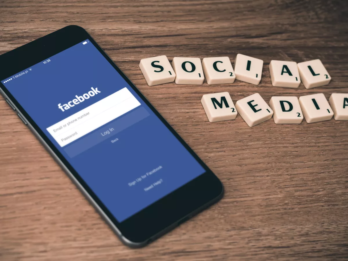 A phone displaying the Facebook login page