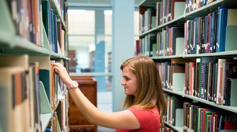 Student browsing library books